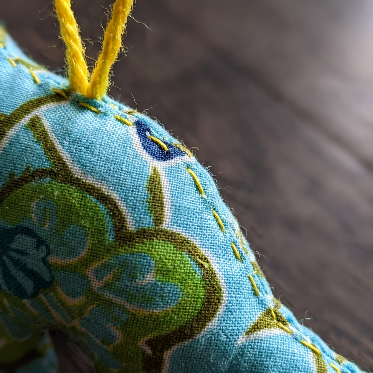 Handcrafted cotton elephant or dinosaur Christmas ornament – Glimmer Amber design, fabric detail. Example from random pack of six.