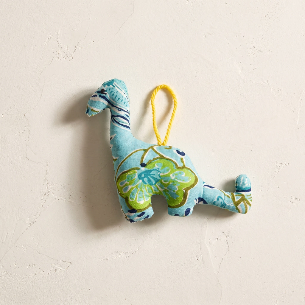 Handcrafted cotton elephant or dinosaur Christmas ornament – Glimmer Amber design, studio hero. Example from random pack of six.