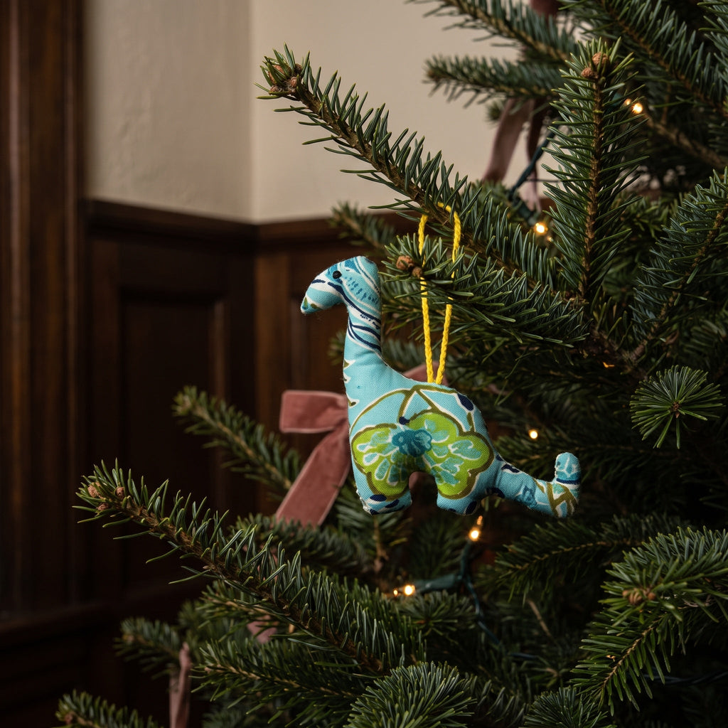 Handcrafted cotton elephant or dinosaur Christmas ornament – Glimmer Amber design, hanging on a Christmas tree. Example from random pack of six.