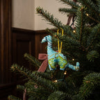 Handcrafted cotton elephant or dinosaur Christmas ornament – Glimmer Amber design, hanging on a Christmas tree. Example from random pack of six.