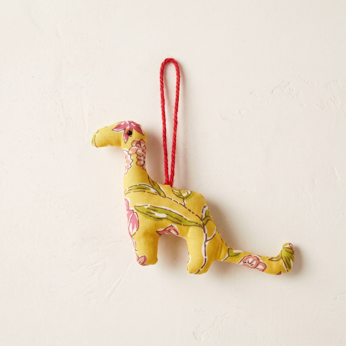 Handcrafted cotton elephant or dinosaur Christmas ornament – Dew Fern design, studio hero. Example from random pack of six.