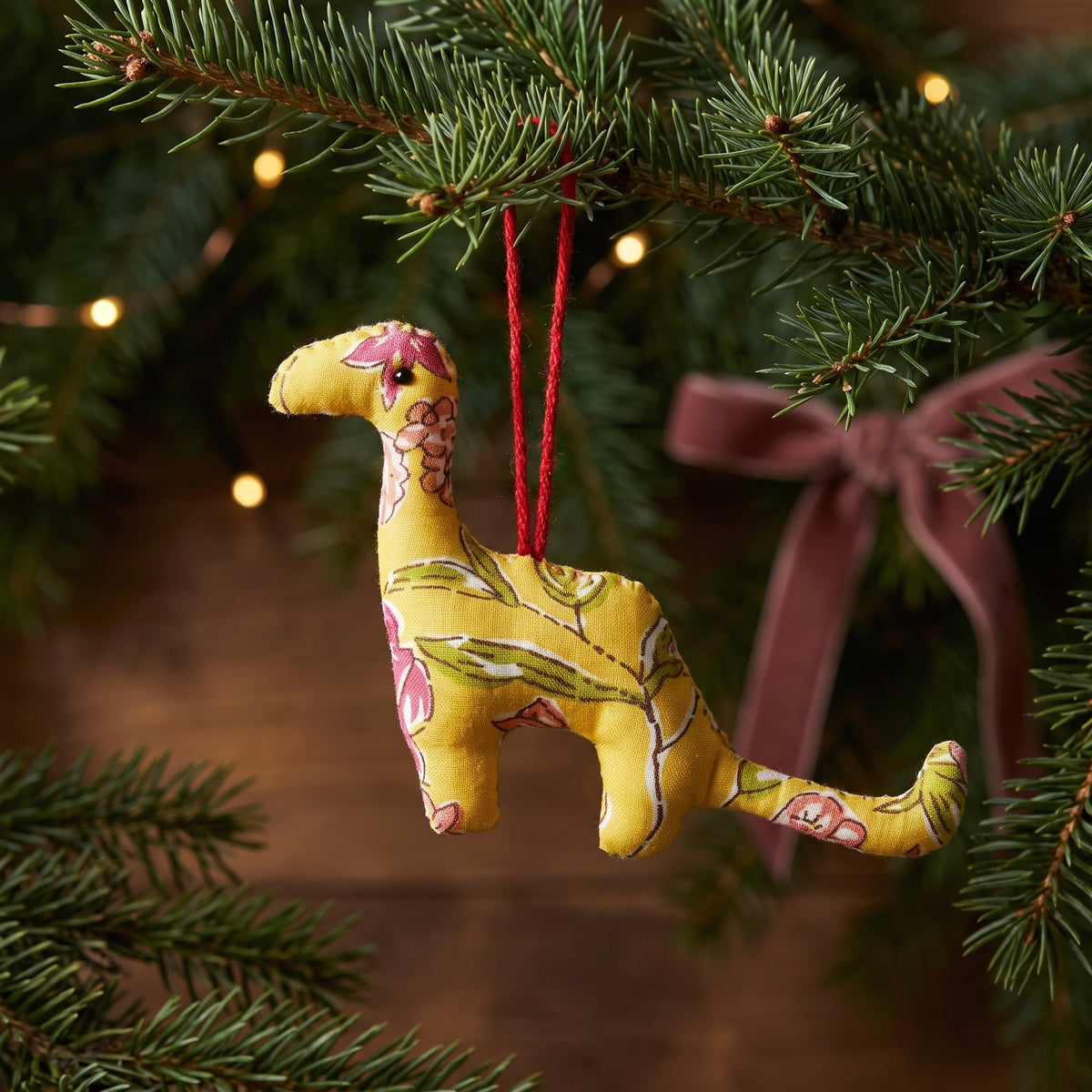 Handcrafted cotton elephant or dinosaur Christmas ornament – Dew Fern design, hanging on a Christmas tree. Example from random pack of six.