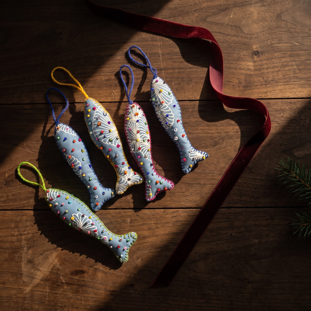 Handcrafted cotton fish Christmas ornament, Clay Dew design – styled photograph. Example from surprise pack of six.
