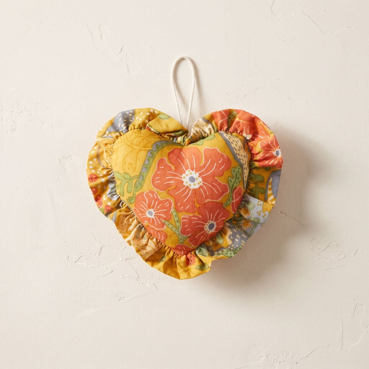 Terracotta Bloom cotton heart ornament – studio view