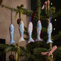 Handcrafted cotton fish Christmas ornament, Clay Dew design – hanging on a Christmas tree. Example from surprise pack of six.