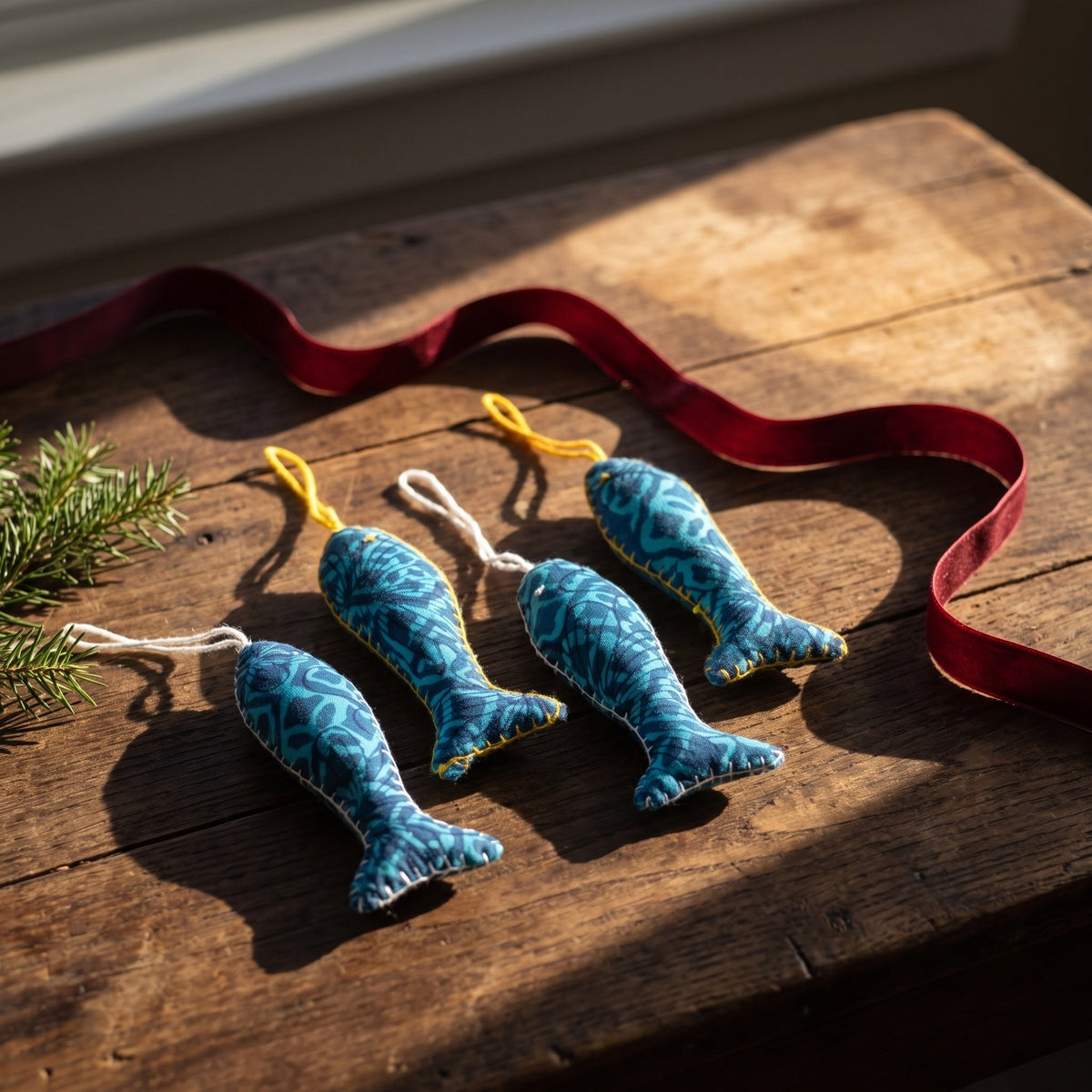 Handcrafted cotton fish Christmas ornament, I Loom design – styled photograph. Example from surprise pack of six.