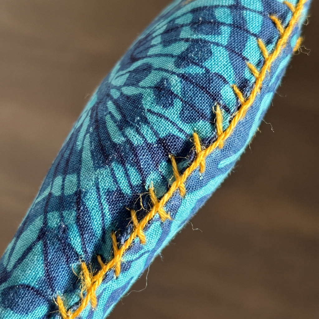 Handcrafted cotton fish Christmas ornament, I Loom design – close-up detail. Example from surprise pack of six.