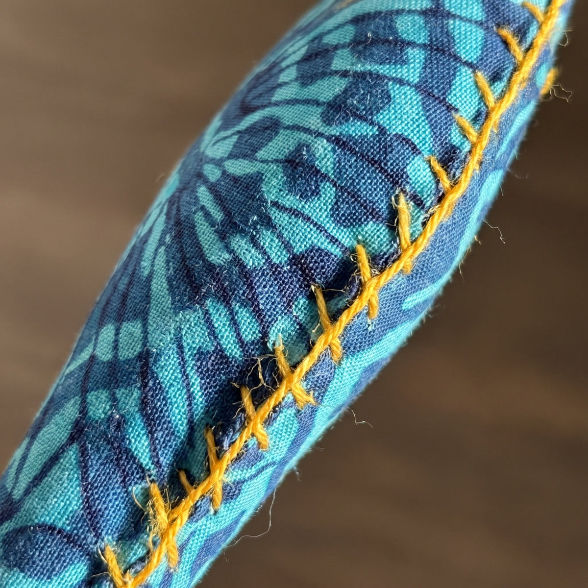 Handcrafted cotton fish Christmas ornament, I Loom design – close-up detail. Example from surprise pack of six.