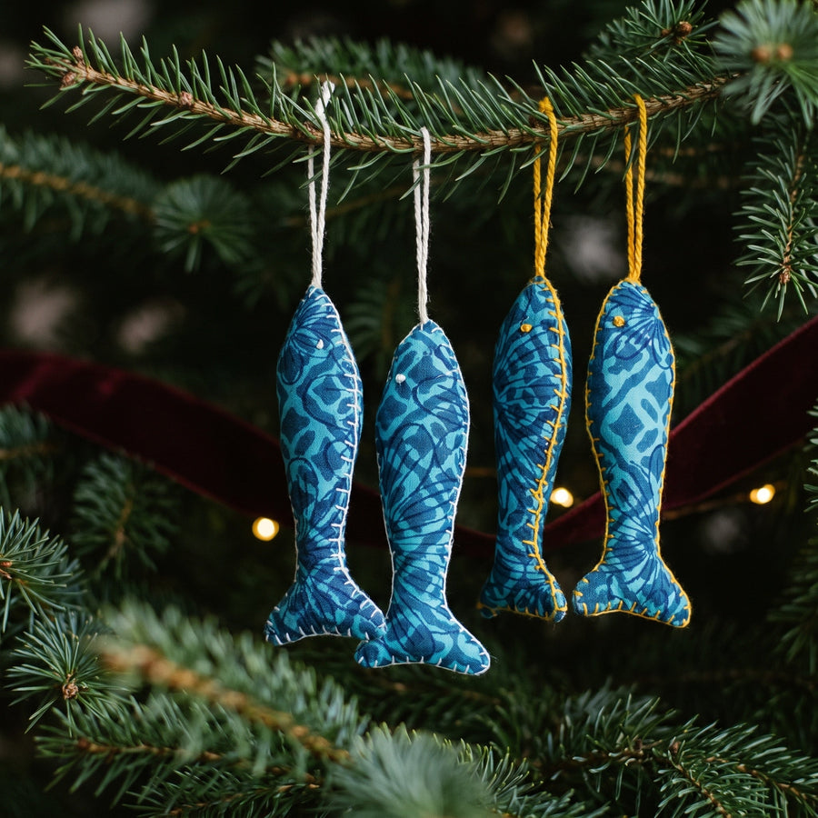 Handcrafted cotton fish Christmas ornament, I Loom design – hanging on a Christmas tree. Example from surprise pack of six.