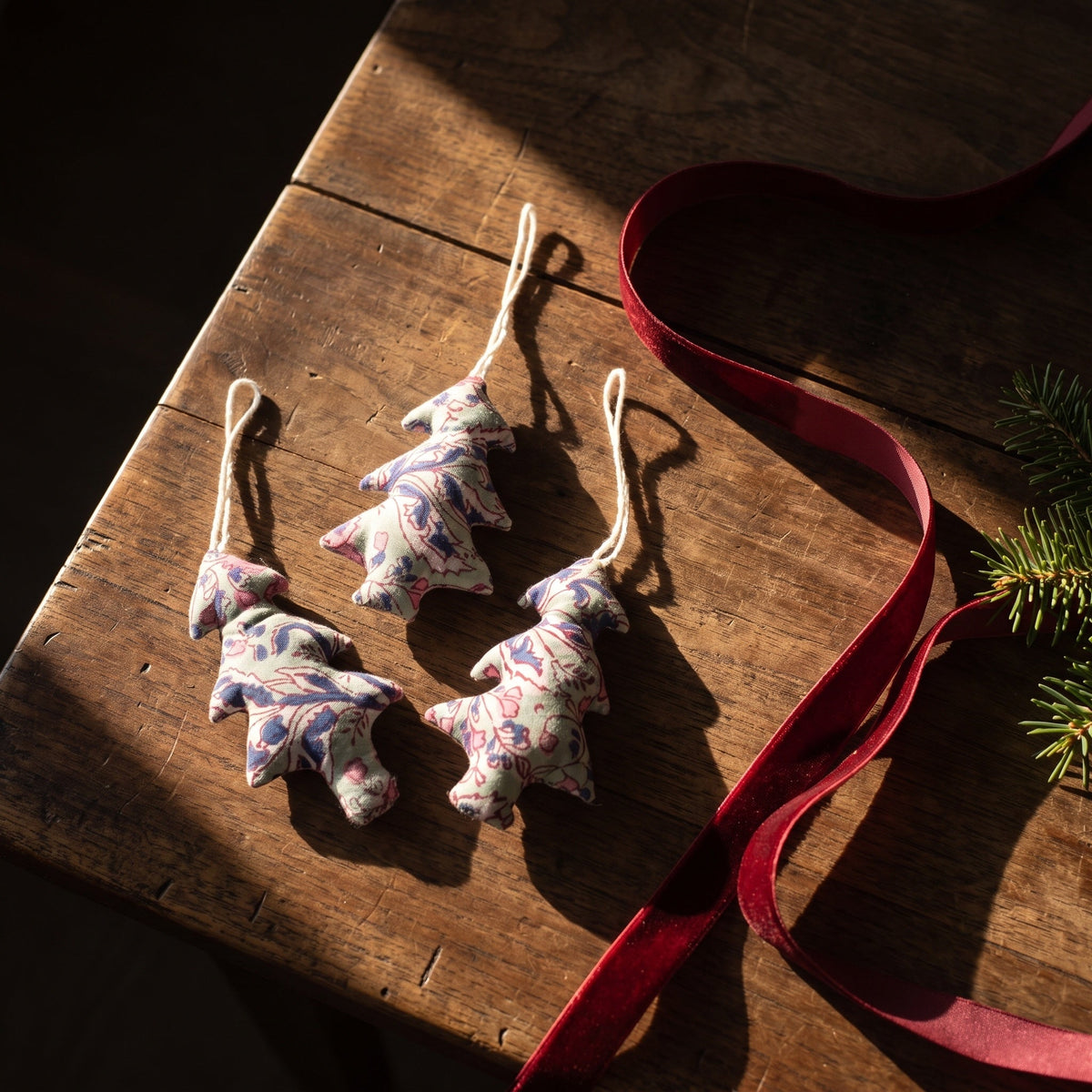 Handcrafted cotton Christmas tree ornament: Heirloom Lotus design, flat lay. Example design in surprise pack of six.