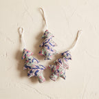 Handcrafted cotton Christmas tree ornament: Heirloom Lotus design, studio view. Example design in surprise pack of six.