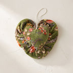 Whisper Lotus cotton heart ornament – studio view