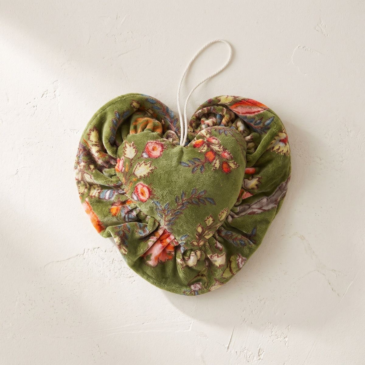 Whisper Lotus cotton heart ornament – studio view