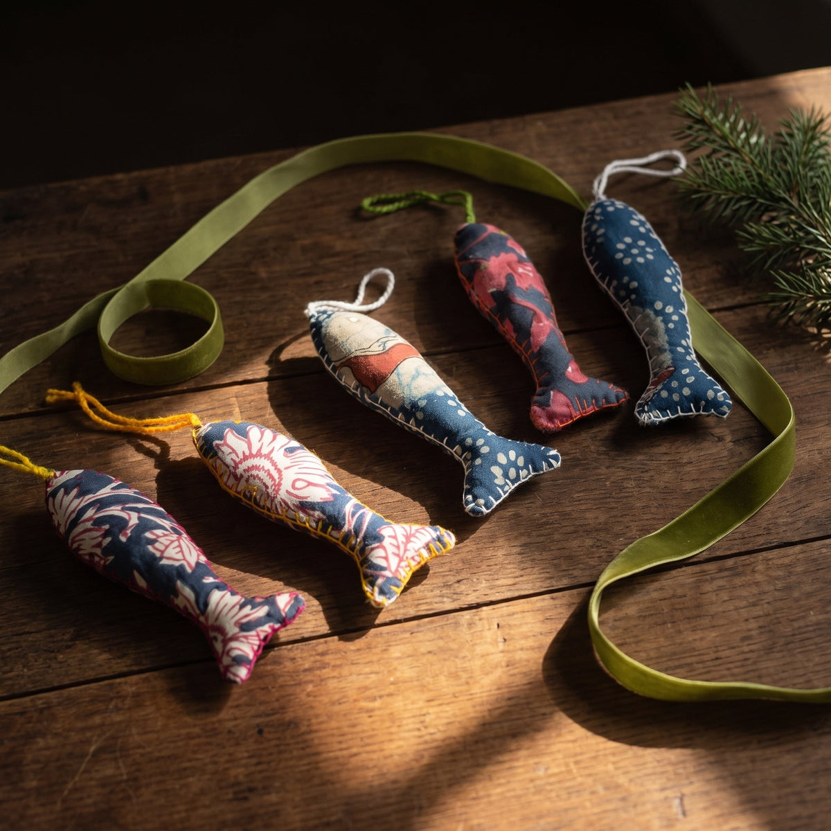 Handcrafted cotton fish Christmas ornament, Verdant Fern design – styled photograph. Example from surprise pack of six.