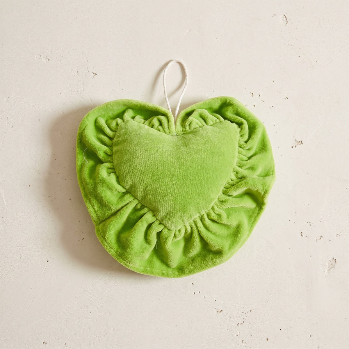 Dewy Fern cotton heart ornament – studio view