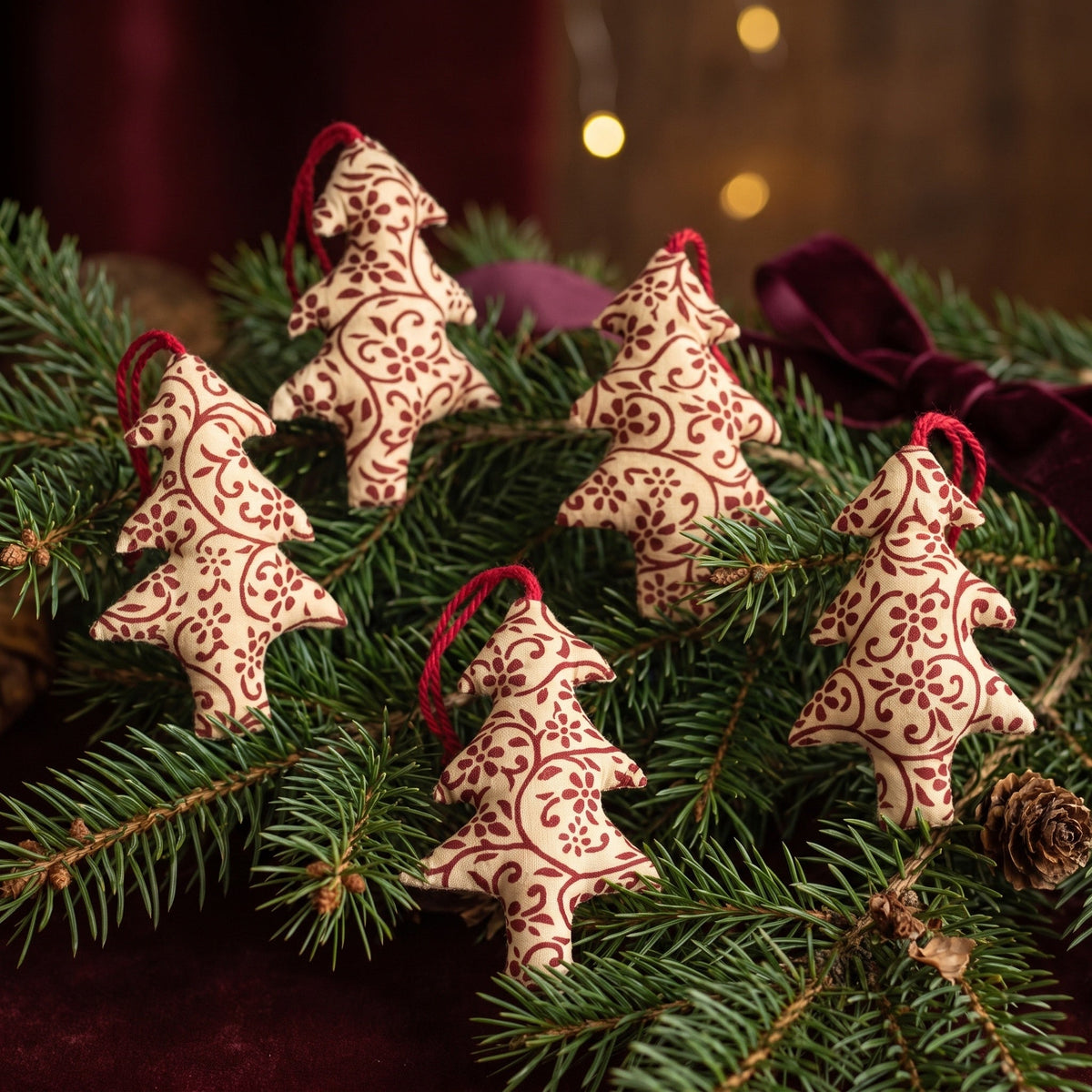 Handcrafted cotton Christmas tree ornament: Stone Bloom design, styled on Christmas tree. Example design in surprise pack of six.