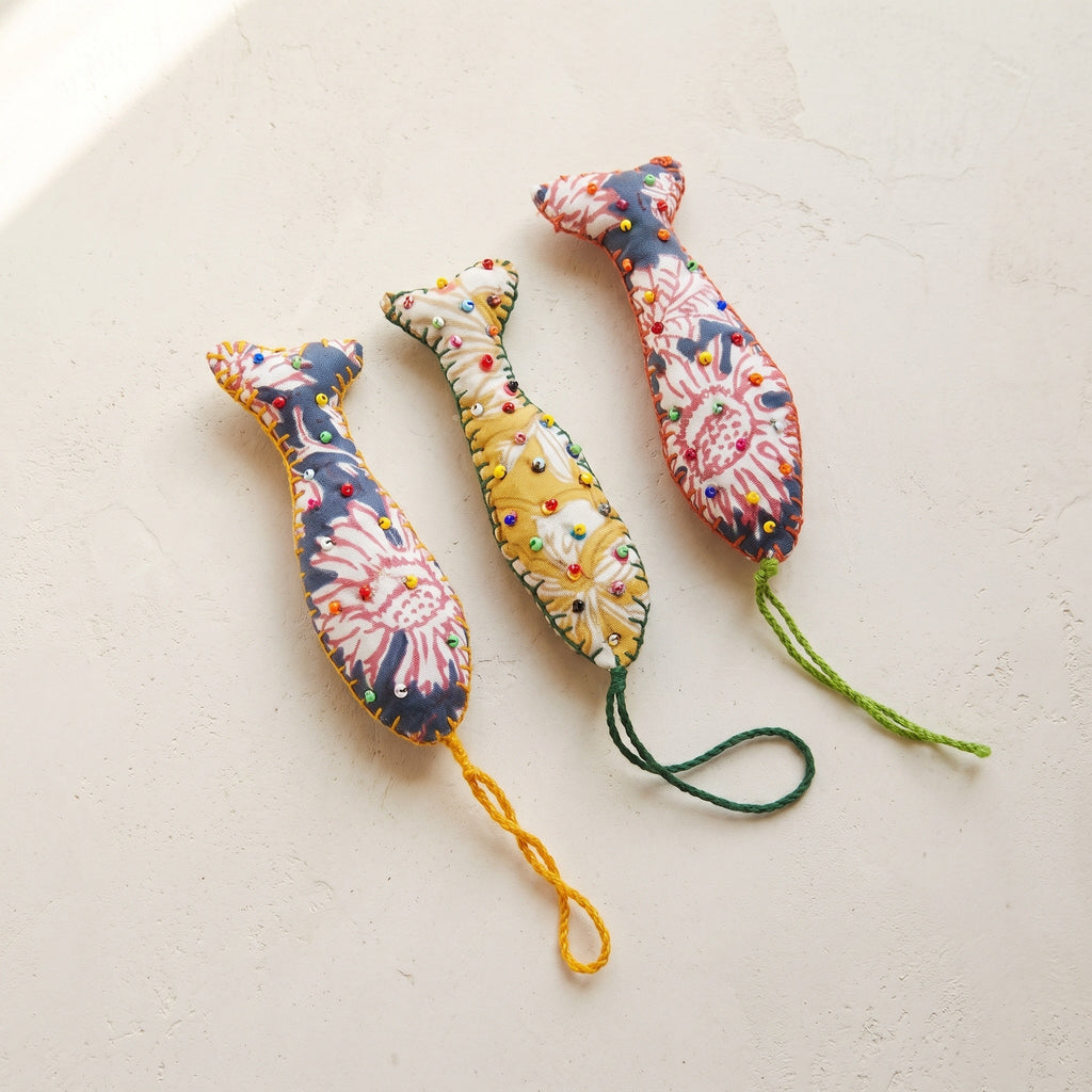Handcrafted cotton fish Christmas ornament, Terracotta Bloom design – studio view. Example from surprise pack of six.