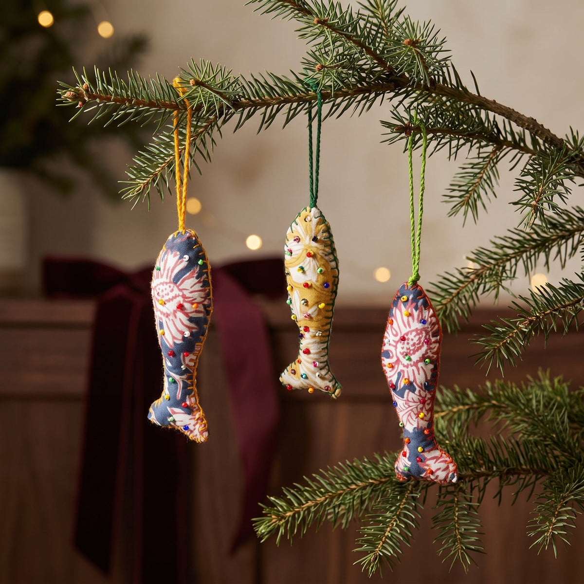 Handcrafted cotton fish Christmas ornament, Terracotta Bloom design – hanging on a Christmas tree. Example from surprise pack of six.
