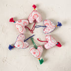 Non-beaded cotton heart Christmas ornament, Sky Gem design – studio view. Example from random assortment of six.