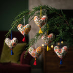 Non-beaded cotton heart Christmas ornament, Gentle Glow design – on a Christmas tree. Example from random assortment of six.
