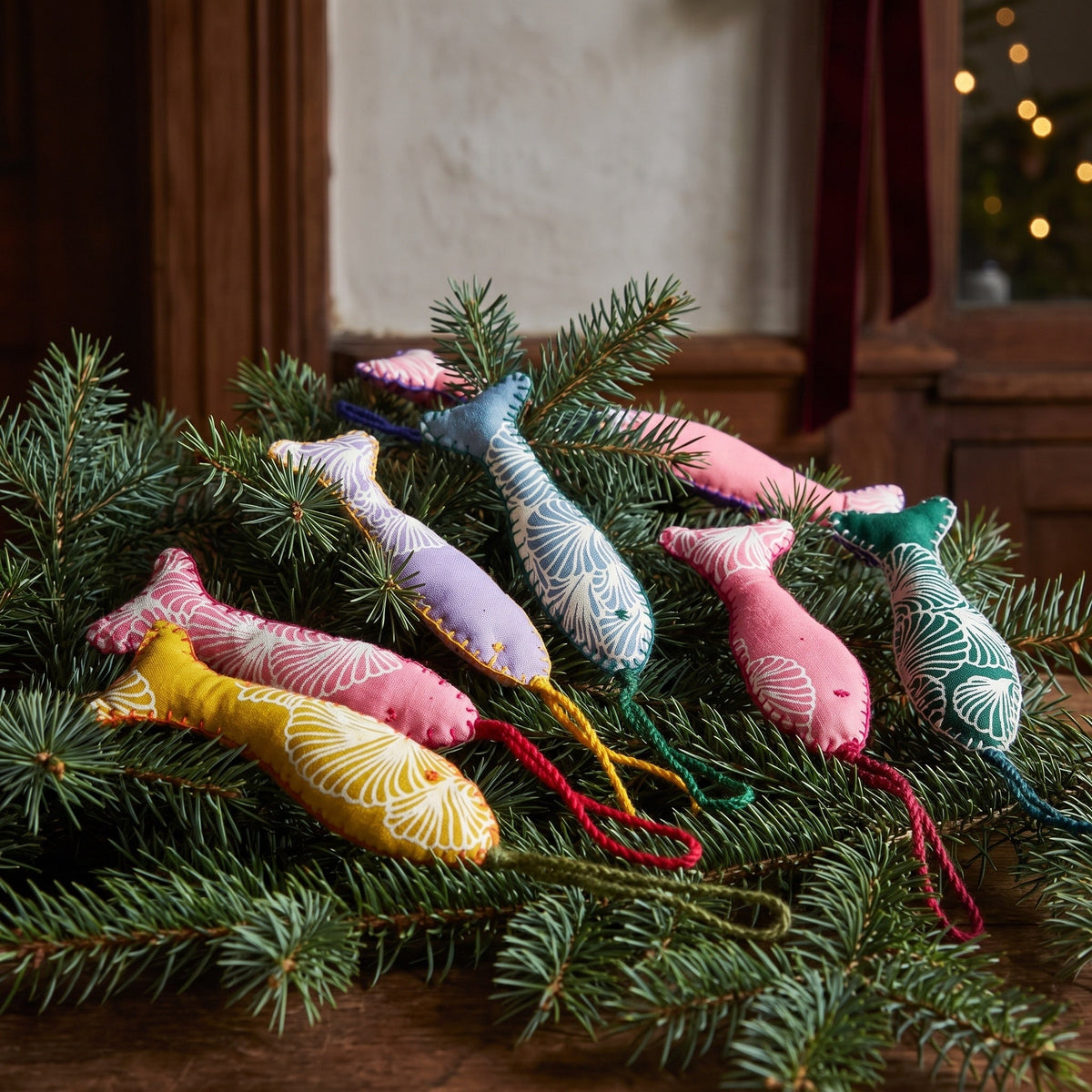Handcrafted cotton fish Christmas ornament, Cobalt Dream design – hanging on a Christmas tree. Example from surprise pack of six.