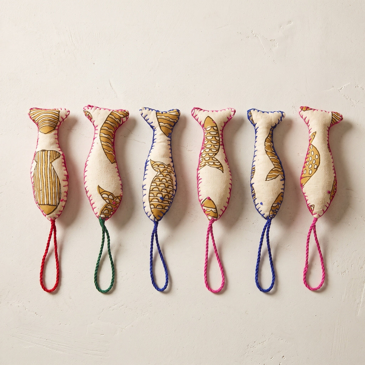 Handcrafted cotton fish Christmas ornament, Woven Indigo design – studio view. Example from surprise pack of six.