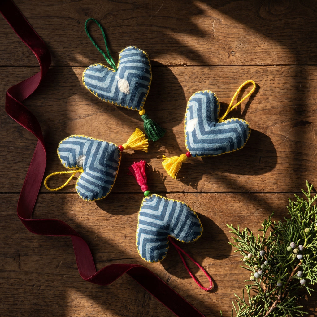 Non-beaded cotton heart Christmas ornament, Mist Tide design – styled flat lay. Example from random assortment of six.