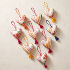 Non-beaded cotton heart Christmas ornament, Drift Terracotta design – studio view. Example from random assortment of six.