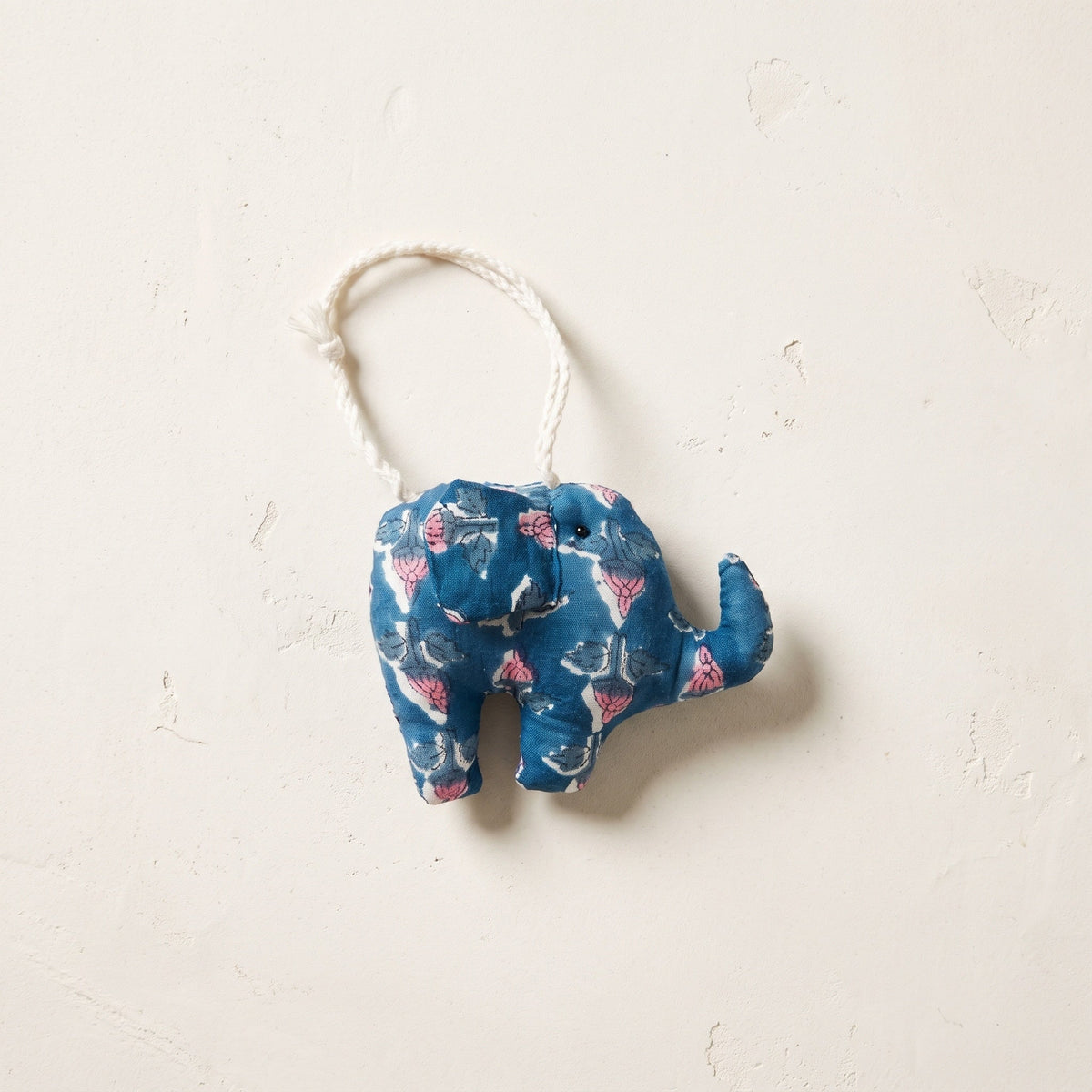 Handcrafted cotton elephant or dinosaur Christmas ornament – Sol Air design, studio hero. Example from random pack of six.