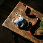 Handcrafted cotton elephant or dinosaur Christmas ornament – Lustre Glow design, styled photo. Example from random pack of six.