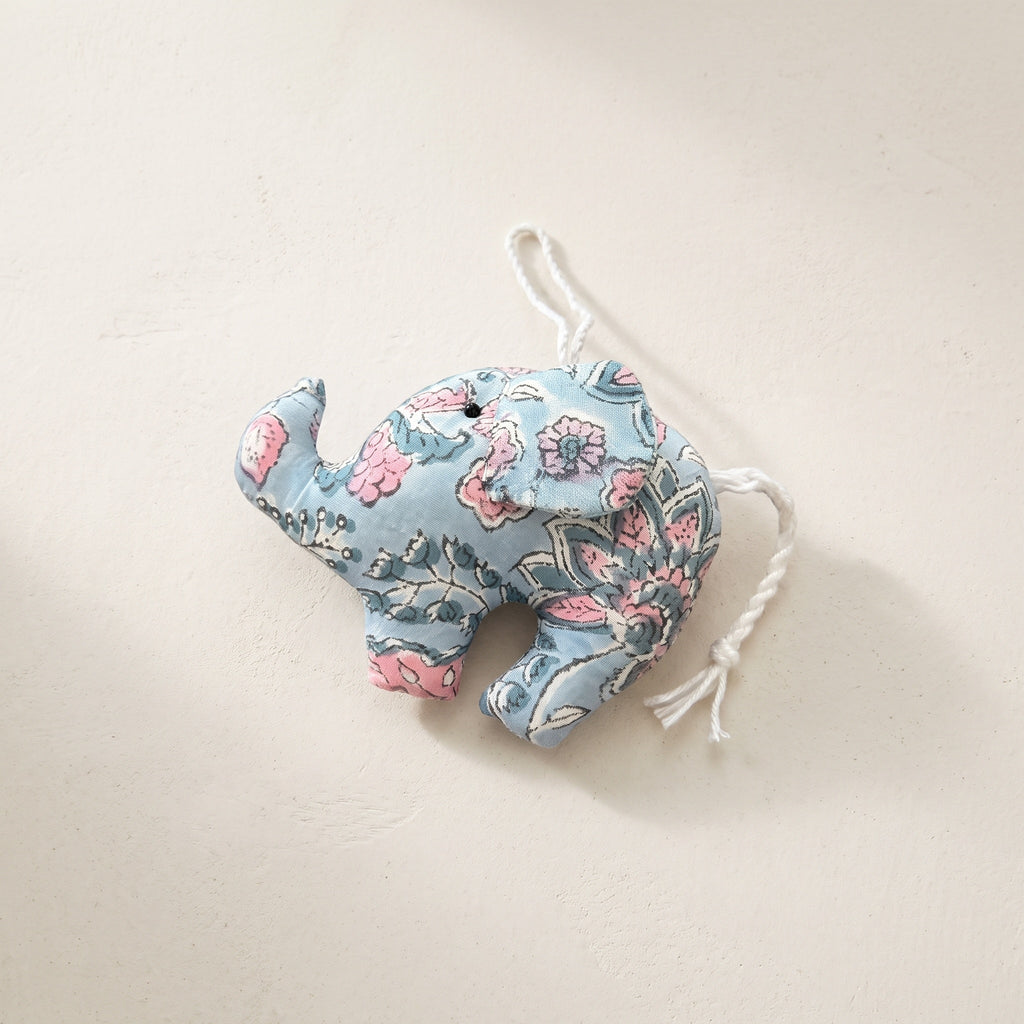 Handcrafted cotton elephant or dinosaur Christmas ornament – Lustre Glow design, studio hero. Example from random pack of six.