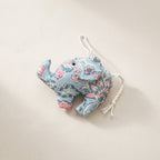 Handcrafted cotton elephant or dinosaur Christmas ornament – Lustre Glow design, studio hero. Example from random pack of six.