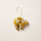 Handcrafted cotton elephant or dinosaur Christmas ornament – Luminous Glow design, studio hero. Example from random pack of six.