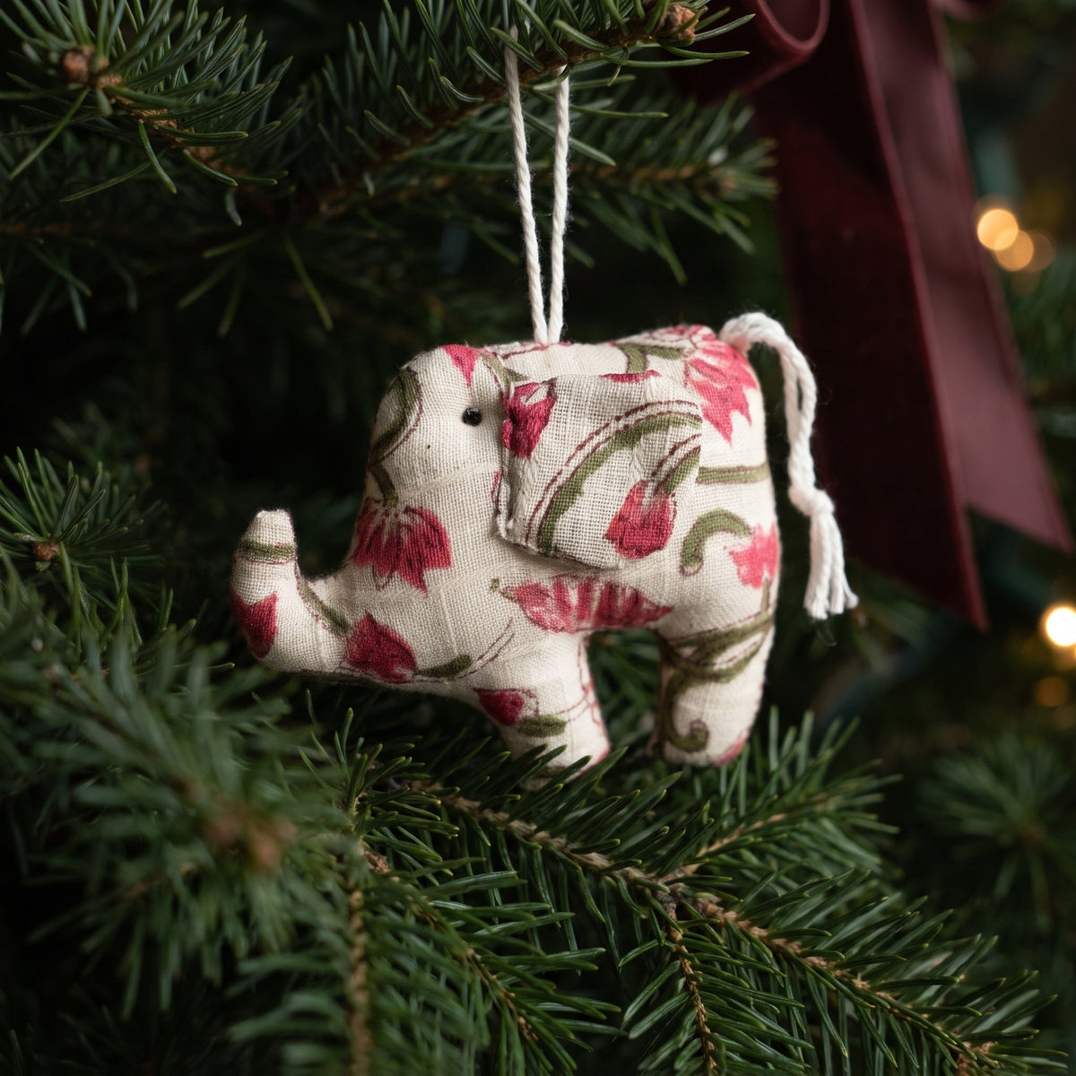 Handcrafted cotton elephant or dinosaur Christmas ornament – Moss Fern design, hanging on a Christmas tree. Example from random pack of six.